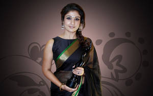 Nayanthara Holding Trophy Wallpaper