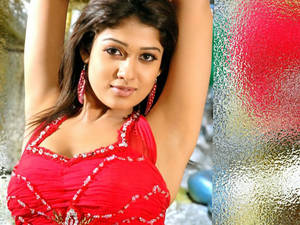 Nayanthara In Red Raising Arms Wallpaper