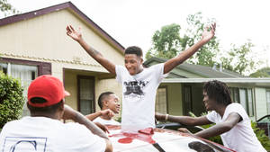 Nba Youngboy Enjoying Time With Friends Wallpaper