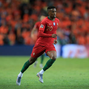 Nelson Semedo Running In All-red Outfit Wallpaper