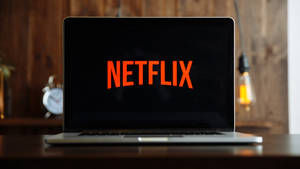 Netflix Laptop On Table Wallpaper