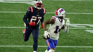 New England Patriots Cornerback Jc Jackson Running After Stephen Diggs Wallpaper