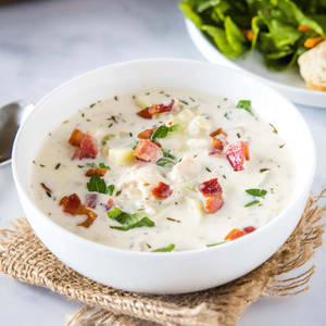 New England Style Clam Chowder Rich With Herbs And Bacon Wallpaper