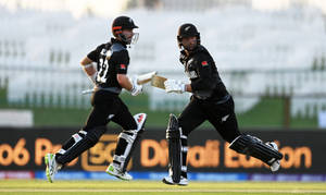 New Zealand Cricket Players Running Wallpaper