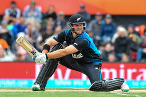 New Zealand Cricketer In Low Stance Posture Wallpaper