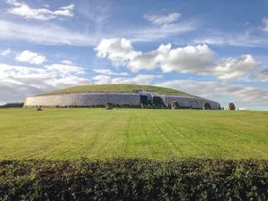 Newgrange Passage Tomb With Blue Sky Wallpaper