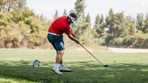 Nick Watney Intently Focusing On His Next Shot On The Golf Course Wallpaper