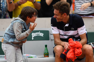 Nicolas Mahut Having A Heartfelt Talk With His Son On The Court Wallpaper