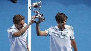 Nicolas Mahut Holding Up Trophy Wallpaper