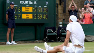 Nicolas Mahut Sitting On The Ground Wallpaper