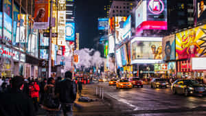 Night Lights Shine Brightly In Times Square. Wallpaper