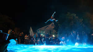 Nighttime Pool Party Jump.jpg Wallpaper