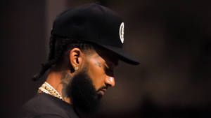 Nipsey Hussle In Relaxing Mood Wallpaper