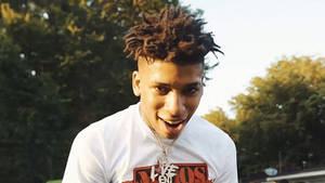 Nle Choppa Brings His Signature Style To The Music Industry Wallpaper