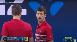 Novak Djokovic And Victor Troicki In Competitive Action Wallpaper