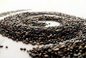 Nutritious Chia Seeds In Distinct Spiral Formation Wallpaper