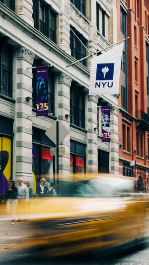 Nyu Banners And Speeding Cars Wallpaper