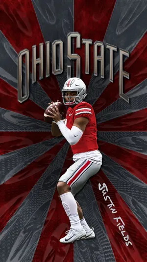 Ohio State Quarterback Justin Fields Delivers A Pass. Wallpaper