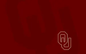 Oklahoma Sooners Logo On A Maroon Background Wallpaper