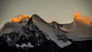 Oled Monitor Snowy Slope Of A Mountain Wallpaper