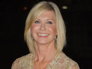 Olivia Newton John In Beige Dress Wallpaper