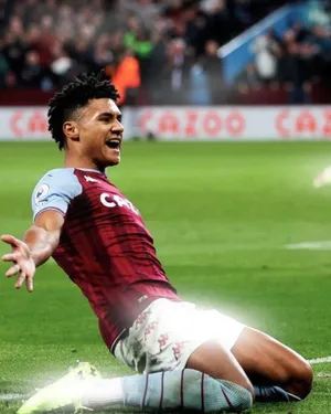 Ollie Watkins Kneeling On The Field Wallpaper