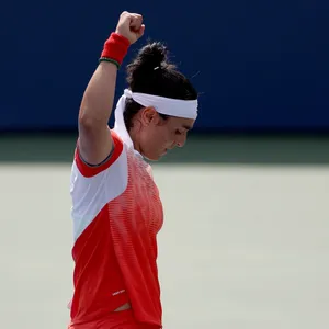 Ons Jabeur Celebrating Victory With Raised Fist Wallpaper