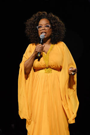 Oprah Winfrey In A Yellow Dress Wallpaper