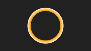 Orange Circle On Black Wallpaper