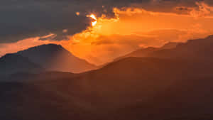 Orange Cloudy Mountains Sunset Landscape Wallpaper