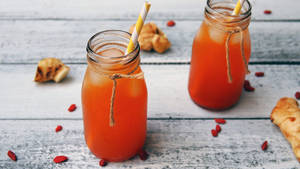 Orange Cordial Drink With Straw Wallpaper