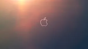 Orange Glow During Sunset Cool Mac Logo Wallpaper