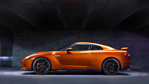 Orange Nissan Gtr Car In Side View Wallpaper