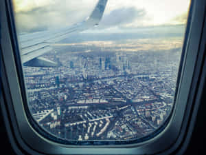 Overlooking City View Inside Airplane Wallpaper