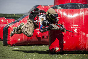 Paintball Player Ready For Action Wallpaper