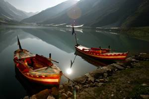 Pakistan Glowing Lake Boats Wallpaper