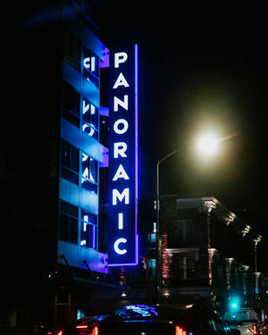 Panoramic Signage In Neon Blue Iphone Wallpaper