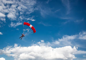 Paragliding Pilot Having Fun Wallpaper