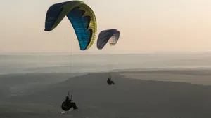 Paragliding With Desert Scenery Wallpaper