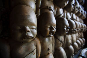 Paranormal Spooky Baby Statues Wallpaper