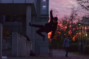 Parkour Stunt On Metal Bar Wallpaper