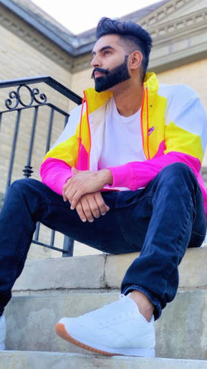 Parmish Verma In Bright-colored Windbreaker Wallpaper