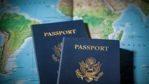 Passport On World Map Vignette Wallpaper