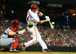 Paul Goldschmidt Hitting Baseball With Bat Wallpaper