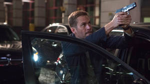 Paul Walker Aiming A Gun Wallpaper