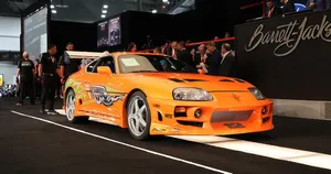 Paul Walker Riding On A Fast Car Wallpaper