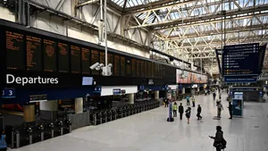 People Checking Departures At Waterloo Station Wallpaper