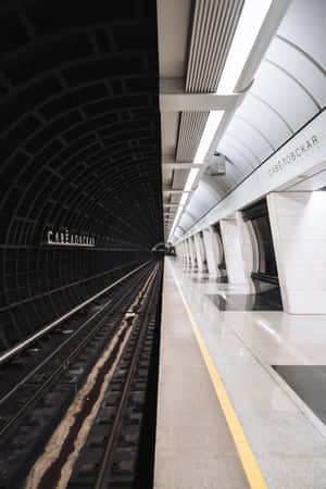People Commuting On The Metro In A City Wallpaper