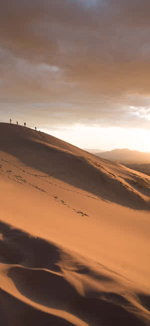 People Traveling In The Desert Iphone Wallpaper