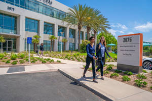 People Walking In Irvine Business Center Wallpaper